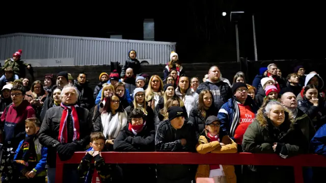 Arsenal fans watch on