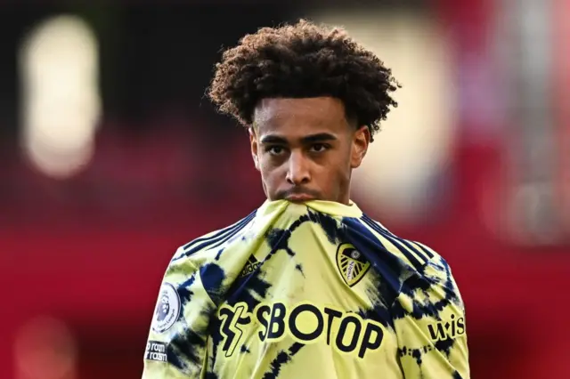 Tyler Adams bites his shirt following Leeds' loss