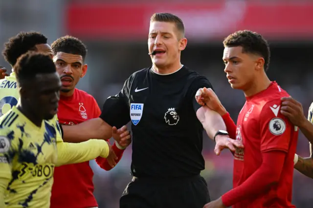 The referee splits up Leeds and Nottingham Forest players