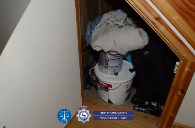 David Carrick's under stairs cupboard open