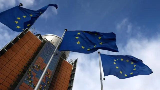 European Union flags flutter outside the EU Commission headquarters, in Brussels