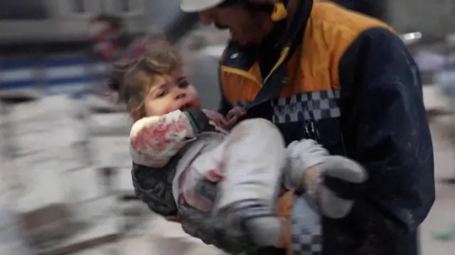 A rescuer carried toddler Raghad Ismail