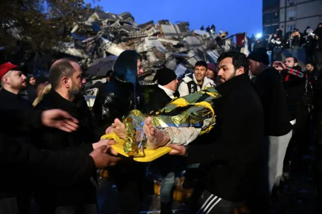 Teams help pull the wounded out of a collapsed building in Gaziantep, Turkey.