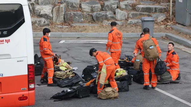 A South Korean international rescue team checks their equipment before heading to Turkey