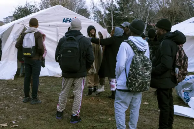 People stand near makeshift tents in Diyarbakir, south-eastern Turkey. Photo: 6 February 2023