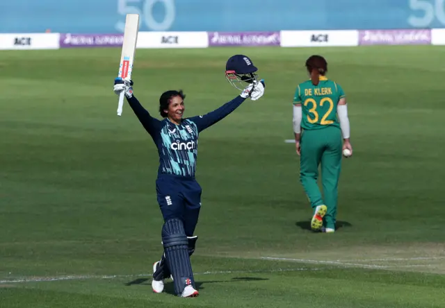 England's Sophia Dunkley celebrates hitting a century against South Africa