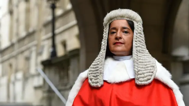 Mrs Justice Bobbie Cheema-Grubb stands outside the Royal Courts of Justice in London