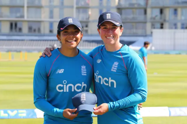 Sophia Dunkley receives her England Test cap from Georgia Elwiss