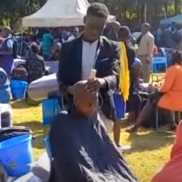 Barber cuts female students hair