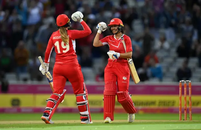 England's Maia Bouchier celebrates with Sophie Ecclestone after guiding England to victory over Sri Lanka in the 2022 Commonwealth Games