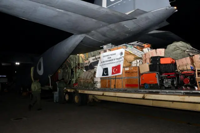 Pakistan Air Force aircraft is loaded with supplies before its departure with the search and rescue teams to help in the aftermath of an earthquake in Turkey, at Nur Khan airbase in Rawalpindi, Pakistan