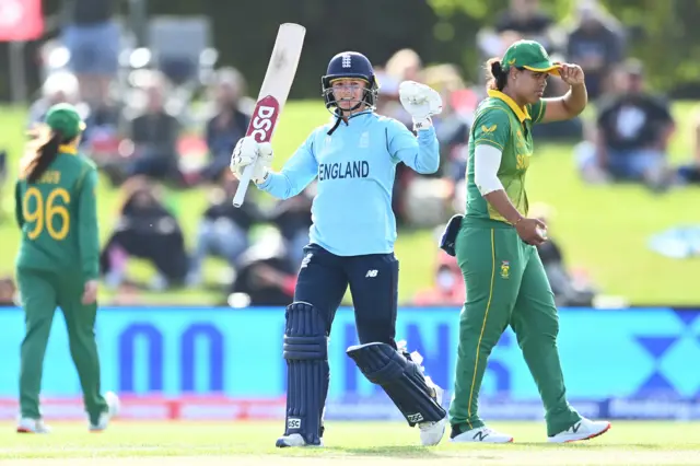 England's Danni Wyatt celebrates hitting a century against South Africa in the semi-final of the 2022 Women's World Cup