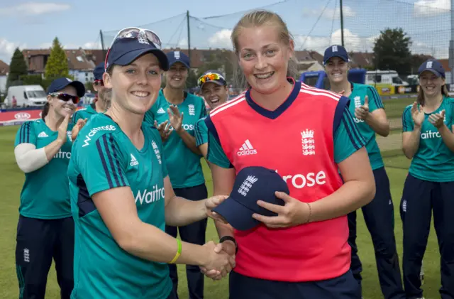 England's Sophie Ecclestone receives her cap from Heather Knight