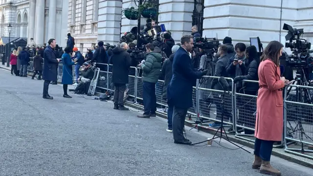 Reporters outside Downing Street