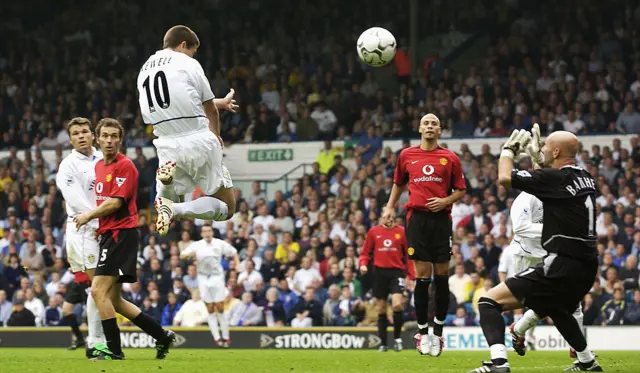 Leeds forward Harry Kewell scores against Manchester United