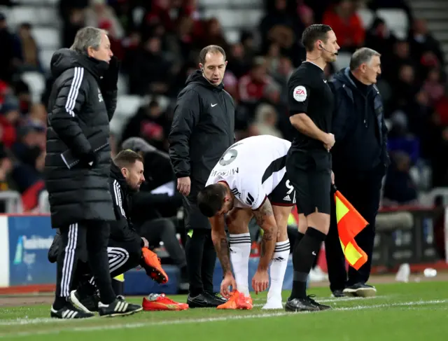 Fulham's Aleksandar Mitrovic changes his football boots