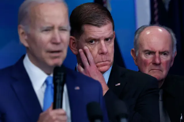 Labour Secretary Marty Walsh (centre)