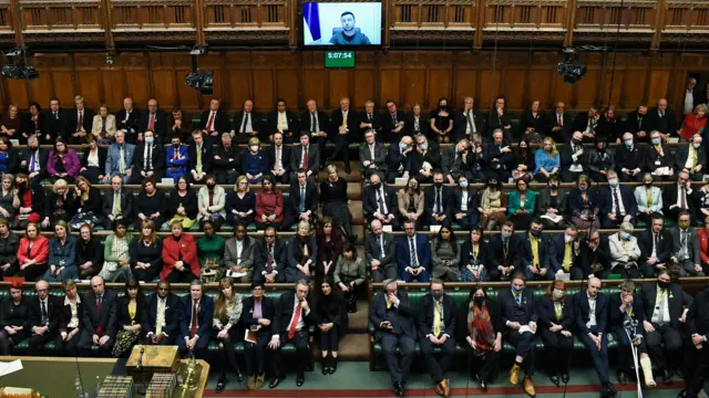 Zelenksy addresses the House of Commons via a video feed