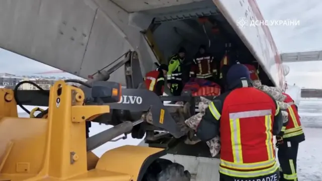 Ukrainian State Emergency Service fill the plane with supplies