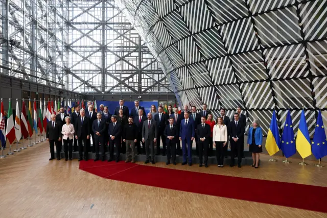 Ukrainian President Volodymyr Zelensky poses with European leaders for a family photo as they attend the European leaders summit in Brussels, Belgium