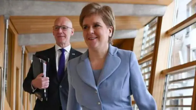 Nicola Sturgeon and John Swinney head to the chamber