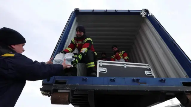 Ukrainian State Emergency Service fill the plane with supplies