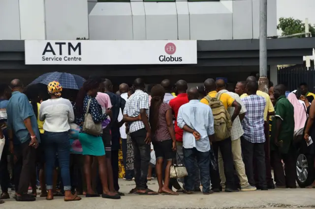 People queuing at ATM