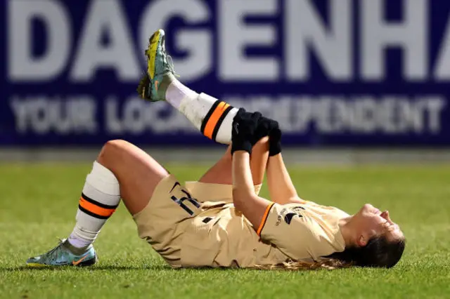 Fran Kirby on ground holding her knee