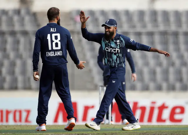 England's Moeen Ali celebrates with Adil Rashid after taking the wicket of Bangladesh's Taijul Islam