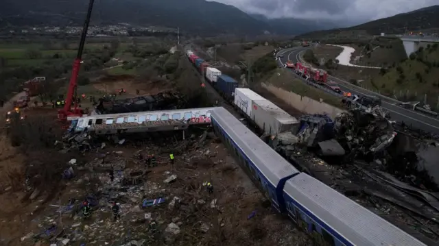 Rescuers at the scene of a rail crash in Greece