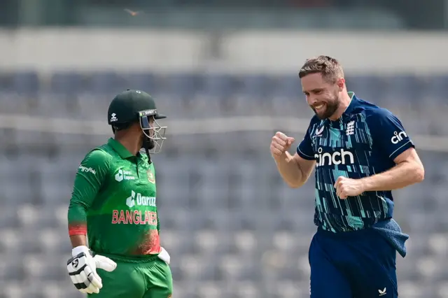 Chris Woakes celebrates the wicket of Litton Das