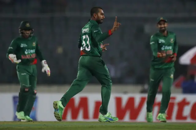 Bangladesh's Mehidy Hasan celebrates after taking the wicket of England's Moeen Ali