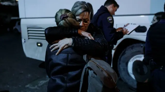 Two women embrace at Thessaloniki railway station