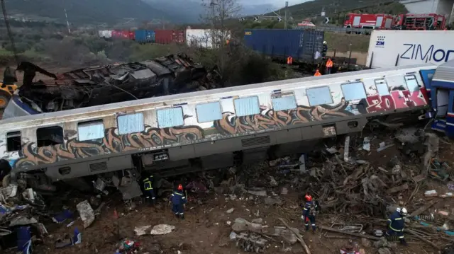 Rescuers at the scene of a rail crash in Greece