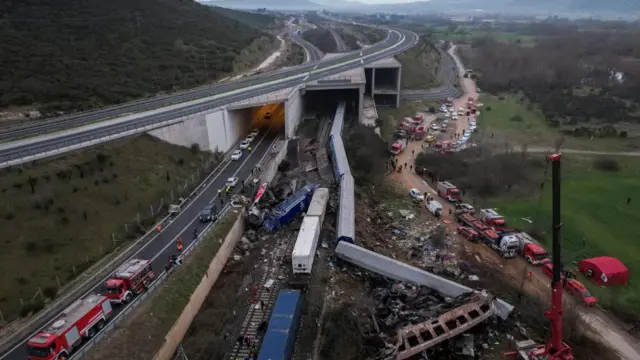 Rescuers at the scene of a rail crash in Greece