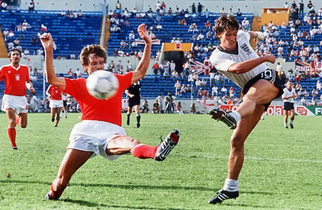 Gary Lineker (R) kicks the ball in the World Cup first round match between England and Poland in 1986 in Mexico