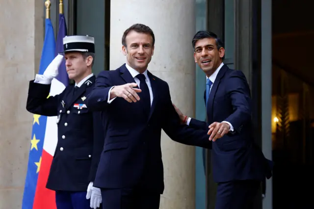 Rishi Sunak and Emmanuel Macron meet on the steps of the Elysee Palace in Paris