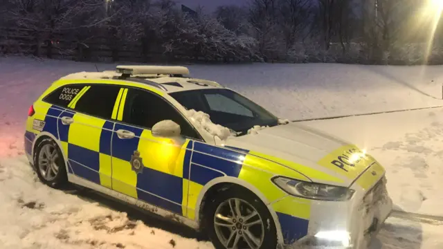 A police car in the snow