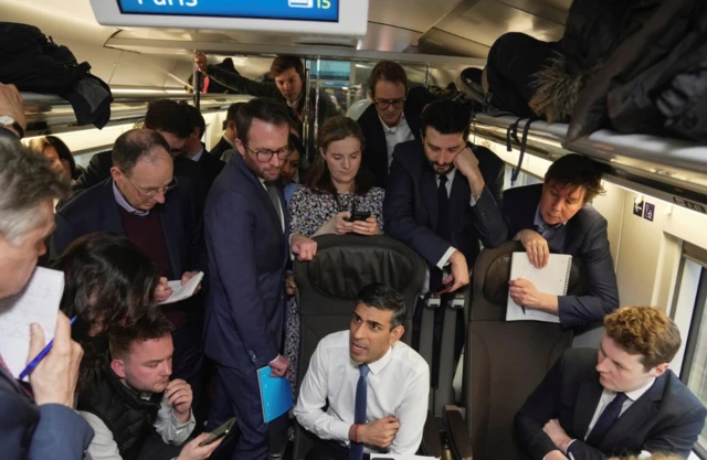 Rishi Sunak speaks to reporters on the Eurostar to Paris