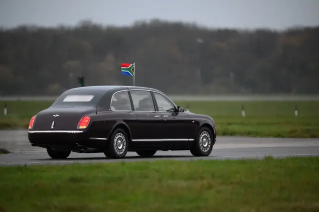 President Cyril Ramaphosa leaves in a car after arriving at Stansted airport in London in November 2022