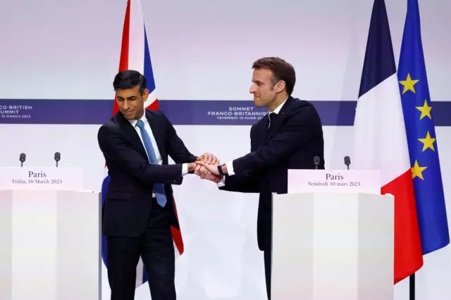 Rishi Sunak and Emmanuel Macron shake hands