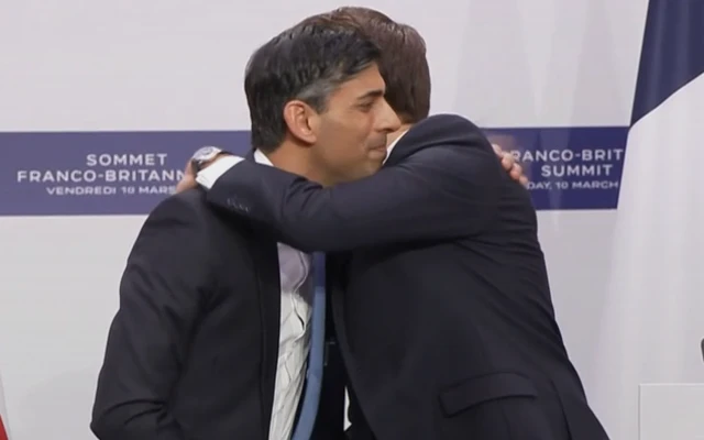 Sunak and Macron embrace