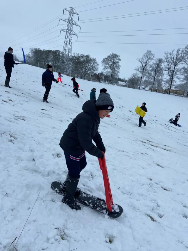 Logan enjoying his snow day, in Ilkley, West Yorkshire