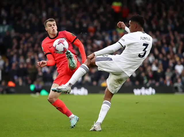 Junior and March battle for the ball