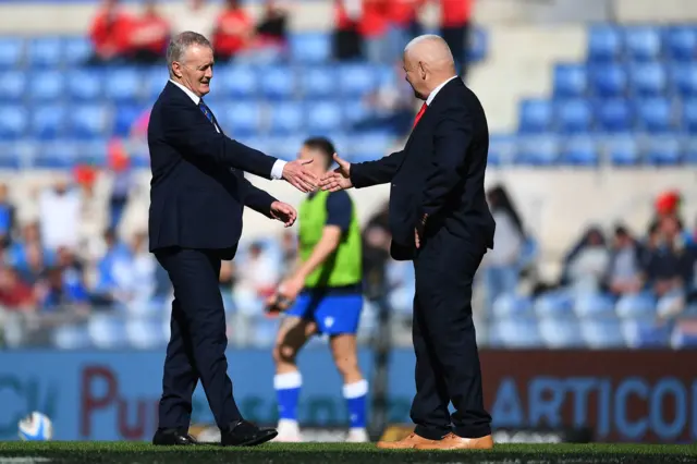 taly head coach Kieran Crowley and Wales head coach Warren Gatland during the warm up