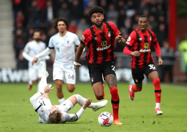 Bournemouth's Philip Billing gets past Liverpool's Harvey Elliott (left) during the Premier League match at the Vitality Stadium