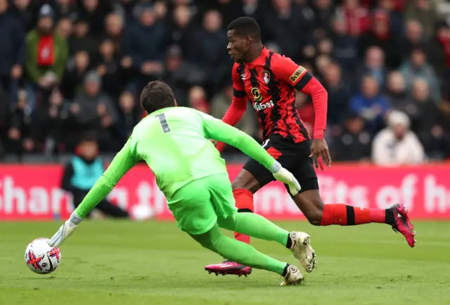 Bournemouth's Dango Ouattara attempts to get past Liverpool goalkeeper Alisson Becker during the Premier League match at the Vitality Stadium, Bournemouth