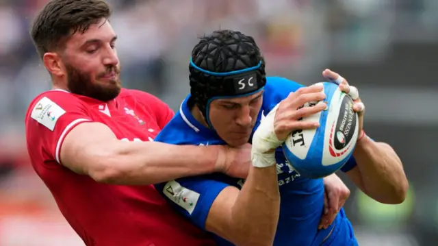 Juan Ignacio Brex is tackled by Owen Williams ahead of the disallowed try