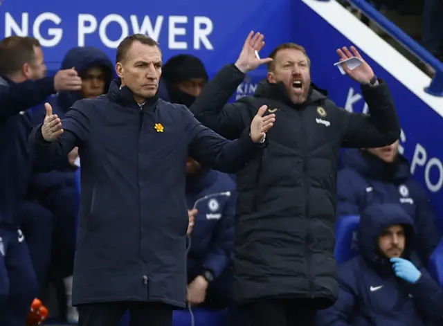 Leicester City manager Brendan Rodgers and Chelsea manager Graham Potter react