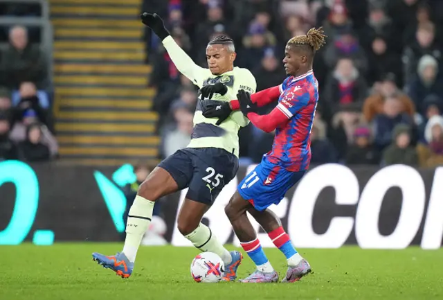 Akanji and Zaha battle for the ball